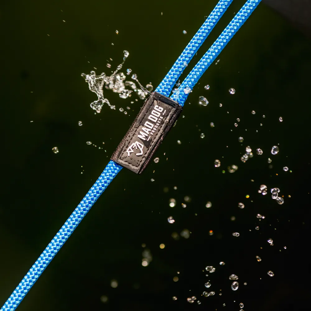 Blue nylon dock line with Mad Dog Products logo in water.