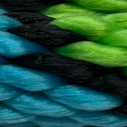 Macro view of intertwined blue, green, and black rope.
